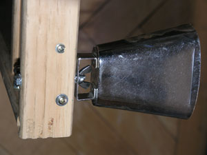 a small bell attached with a wingnut