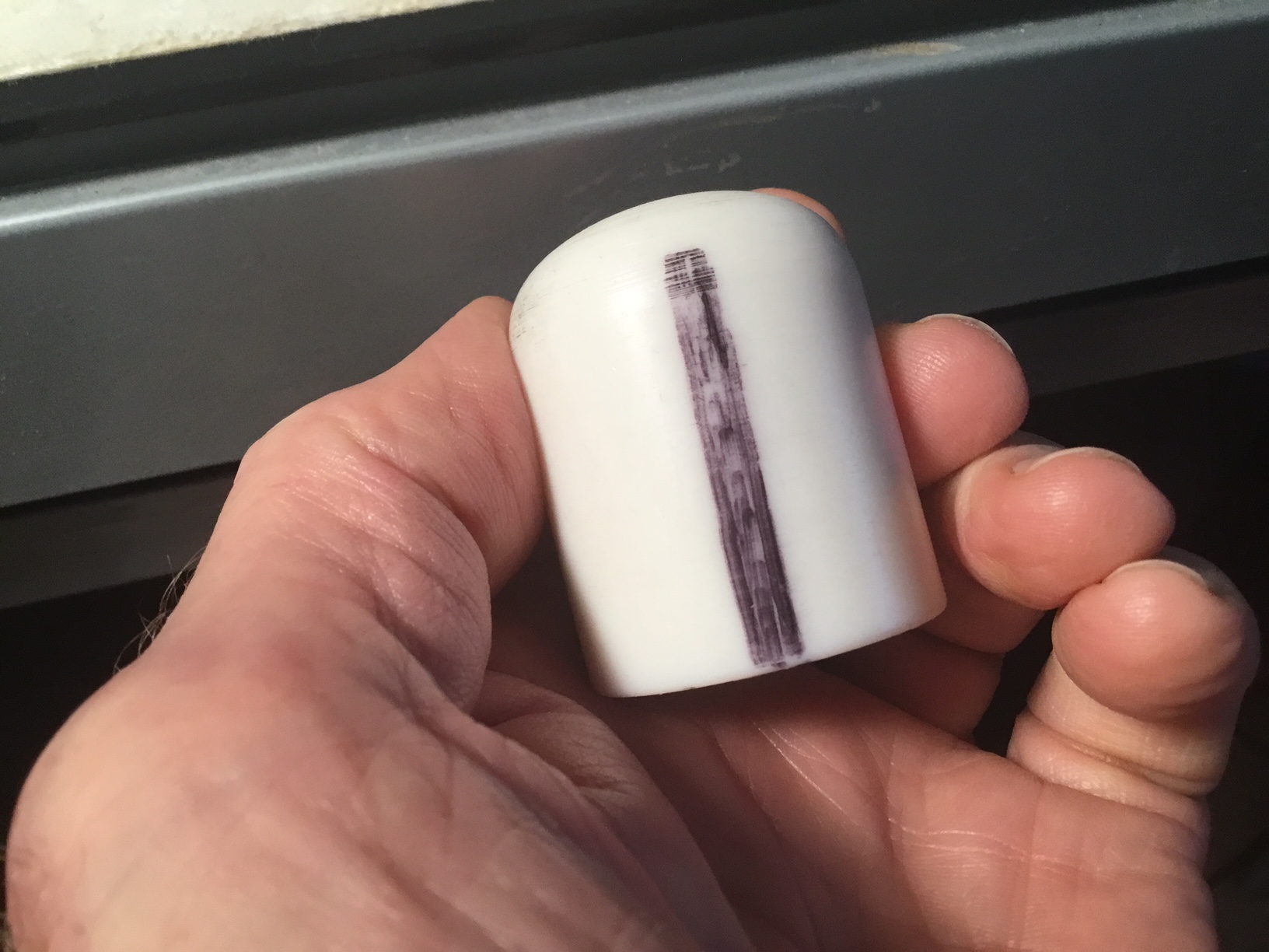Since the Thumb Thumper is custom fitted to my right thumb by means of carving it with a dremel after roughing in a hole with a drill, it is necessary to orient it rotationally before I put it on. That is why there is a witness mark on it.